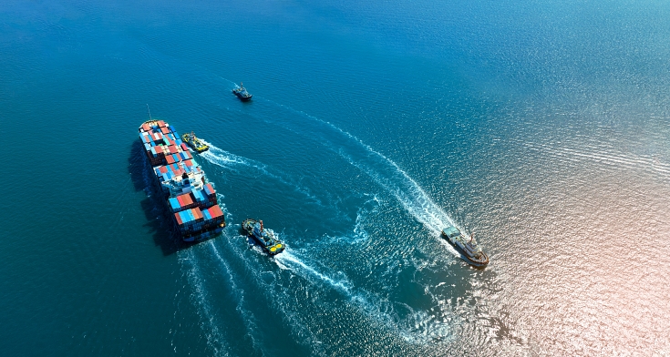 Container ship was dragged by tug boat to international cargo port for service transportation ,logistic service transportation and maintenance concept