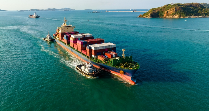 cargo container ship carrying in sea import export goods and distributing products to dealer consumers across Asia pacific and worldwide global business transportation by container ship open sea aerial view