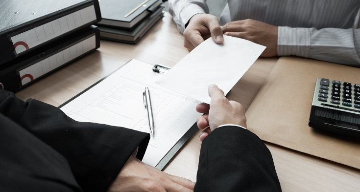 Businessman received a FSS Administrative Complaint on the table in the office. 